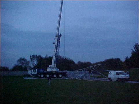the mast is hoisted into place