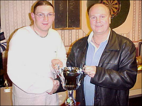 Matt Wilson receives the Dewhurst Trophy from Len Dewhurst